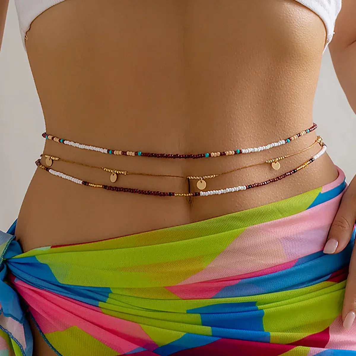 Boho Beats Beaded Waist Chain featuring vibrant seed beads and gold accents, perfect for festival style.
