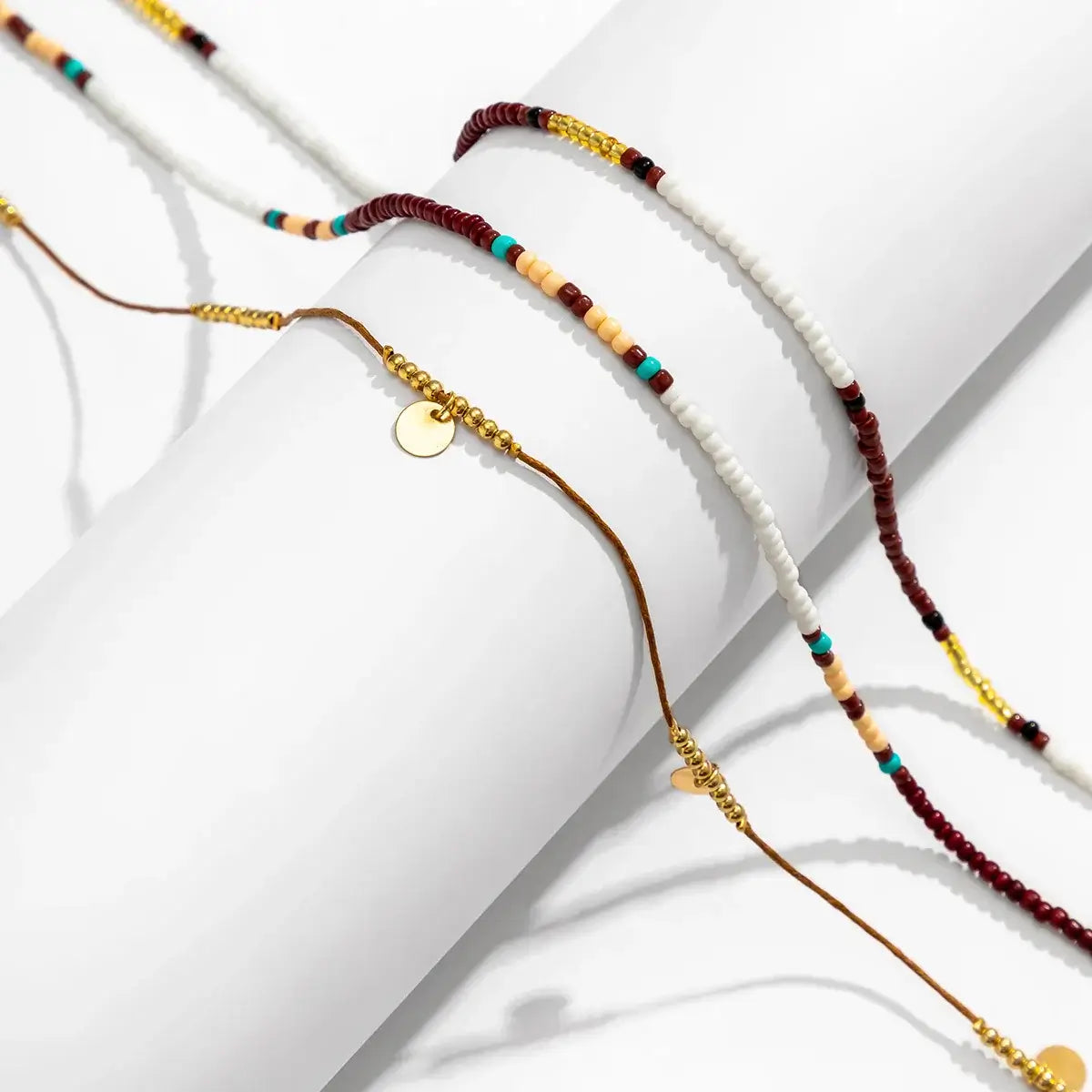 Boho Beats Beaded Waist Chain featuring vibrant seed beads and gold accents on a white background.