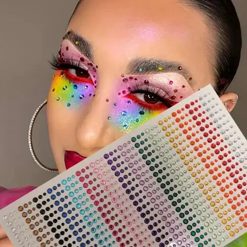 Model showcasing iridescent face gems in rainbow colors, perfect for festival makeup and glam.