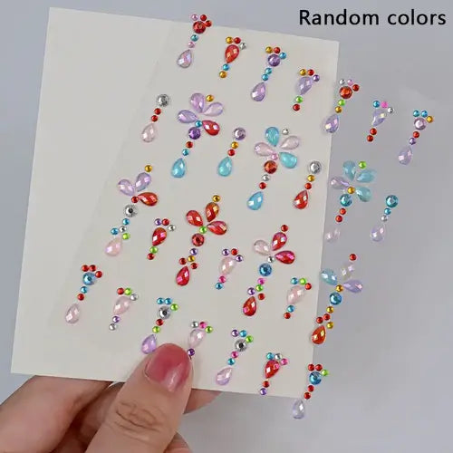 Colorful iridescent face gems stickers in various shapes, perfect for festival glam and easy application.