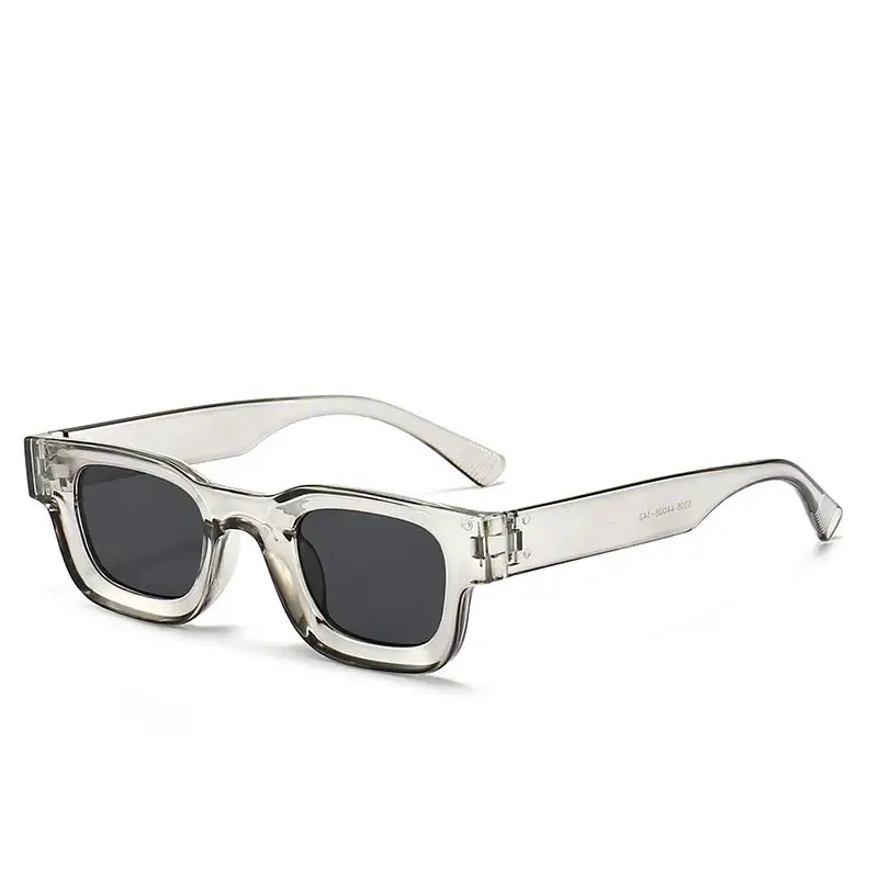 Bold block sunglasses with retro rectangular frames, clear finish, and dark lenses, perfect for stylish occasions.
