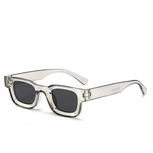 Bold block sunglasses with retro rectangular frames in transparent gray, perfect for trendy outings.