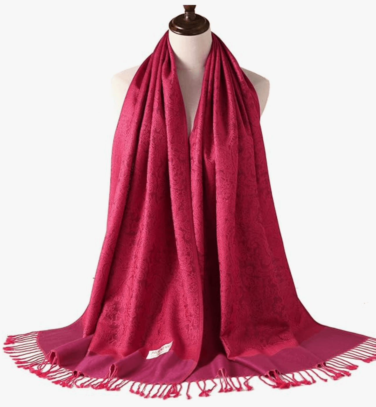 Celestial Horizons Pashmina Collection in rich magenta color draped elegantly on a mannequin.