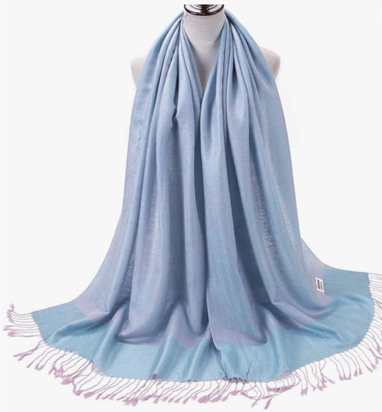 Celestial Horizons pashmina scarf in soft blue with delicate fringe, perfect for adding elegance to any outfit.