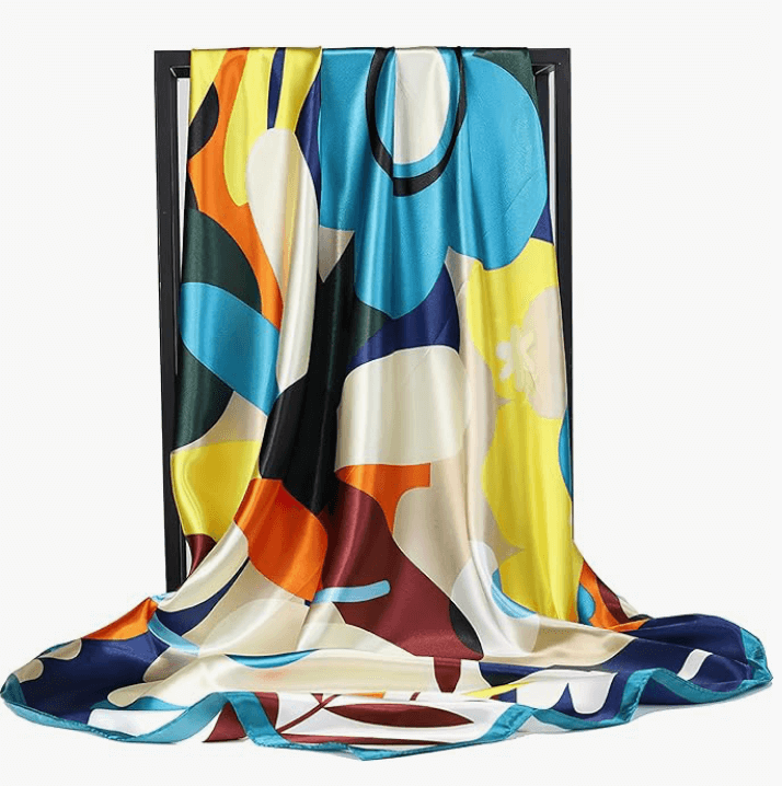 Eclipse Luxe Satin Scarf with abstract colorful patterns, draped elegantly, showcasing its soft and stylish design.