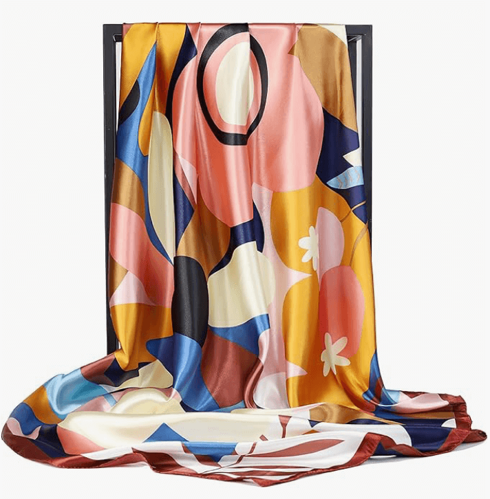 Eclipse Luxe Satin Scarf featuring a vibrant floral design, draped elegantly to showcase its soft, silky texture.
