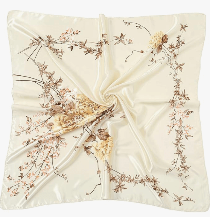 Luna Satin Headscarf in luxurious ivory with floral design, perfect for styling as a headwrap or accessory.
