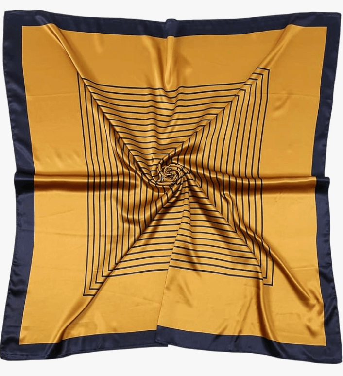 Luna Satin Headscarf in golden hues with navy border and spiral stripe pattern, perfect for stylish wraps and accessories.