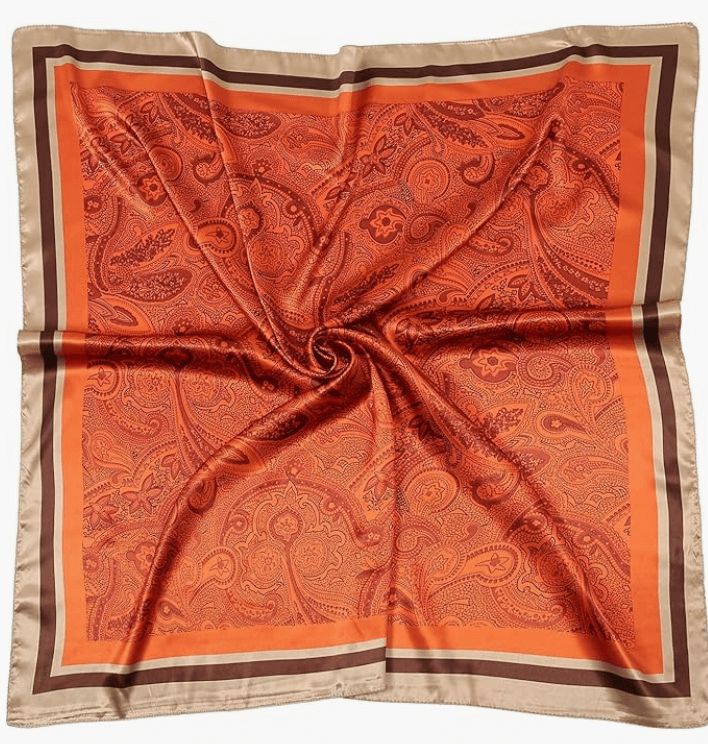 Luna Satin Headscarf in vibrant orange paisley and border design, perfect for stylish headwraps and accessories.