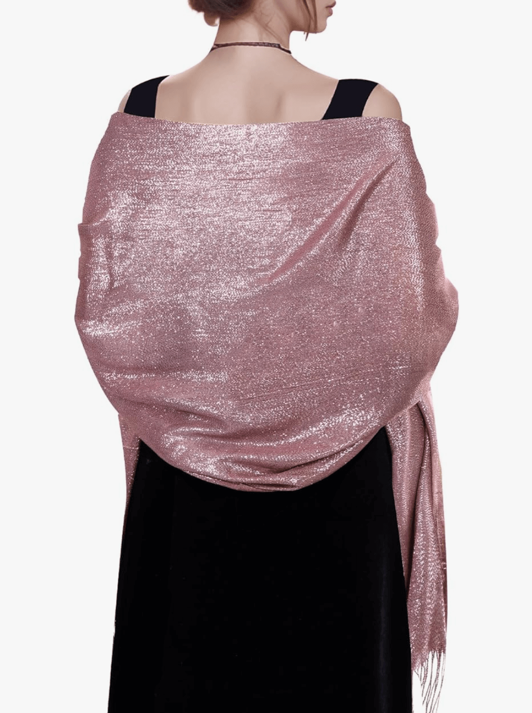 Woman wearing a pink sparkly pashmina wrap, showcasing its metallic shimmer and elegant drape.