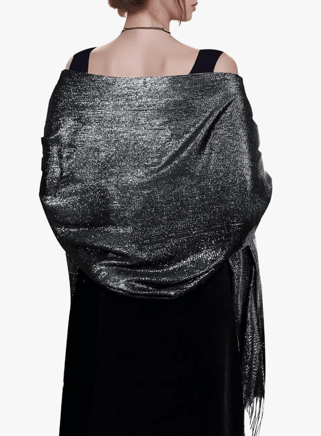 A woman draped in a sparkly black pashmina shawl, showcasing its shimmer and lightweight design.