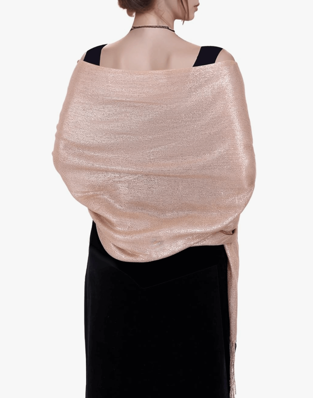 Model wearing a sparkly pashmina wrap in a soft metallic pink hue, showcasing its elegant shimmer.