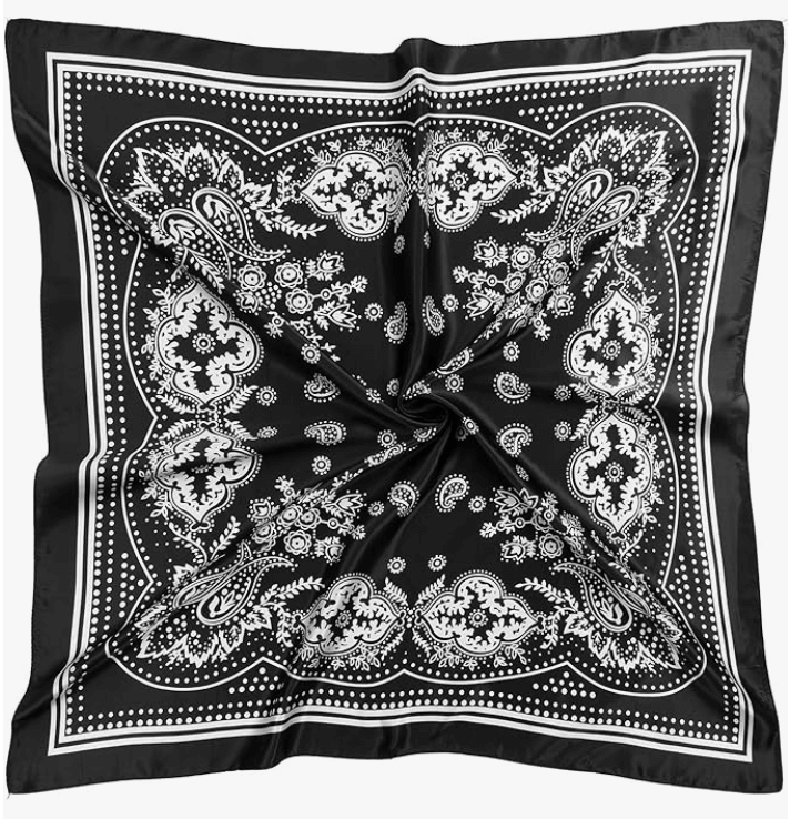Black satin headscarf with white paisley and floral patterns, perfect for styling and accessorizing any outfit.