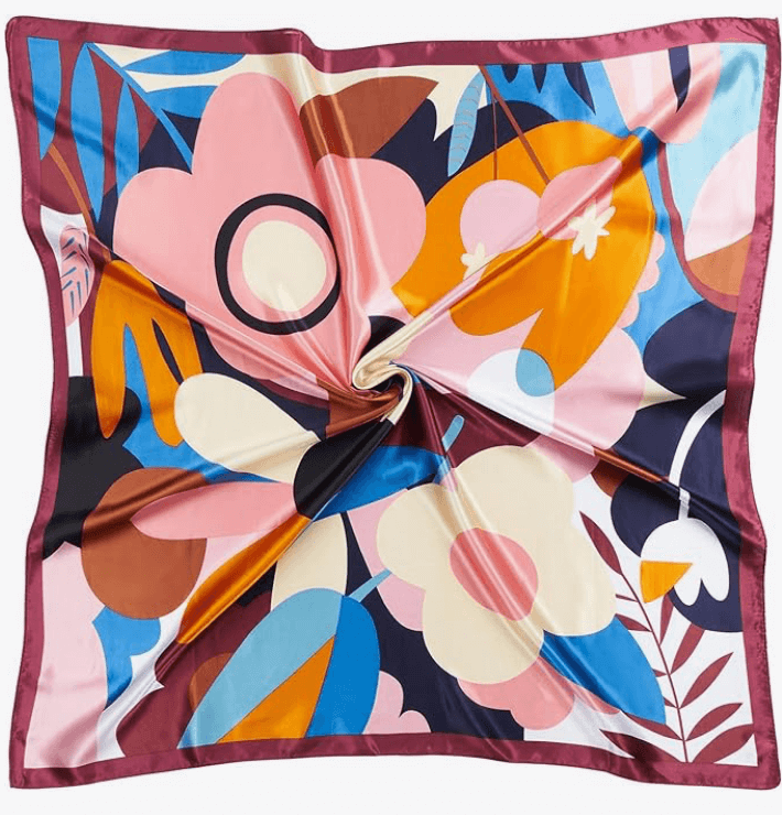 Vibrant Starluxe Satin Headscarf with colorful floral pattern, perfect for festivals and everyday glam.