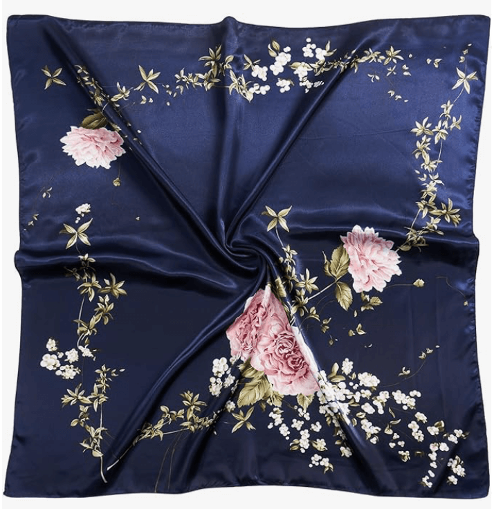 Navy satin headscarf with floral design featuring pink roses and white flowers, perfect for stylish accessorizing.
