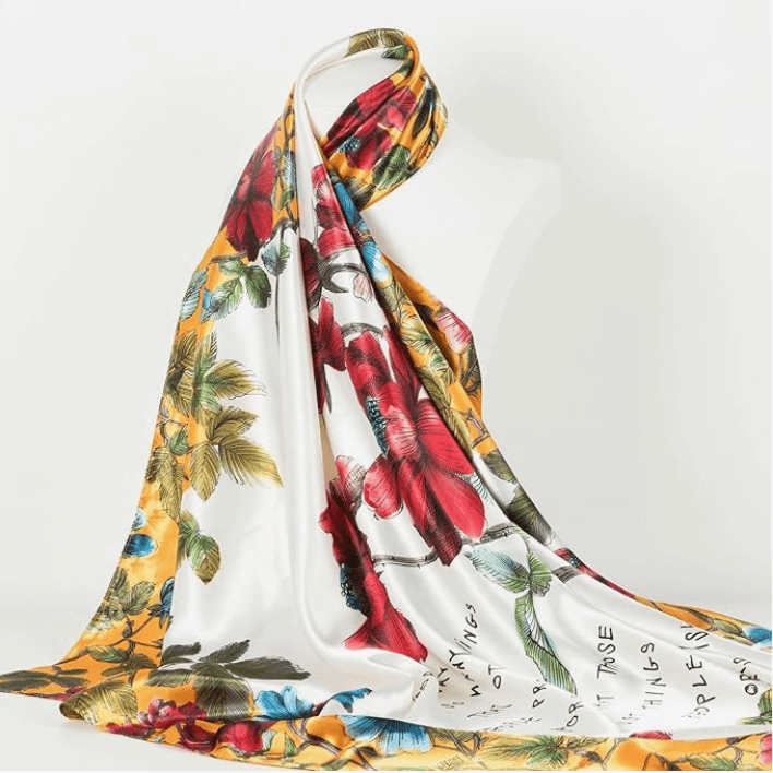 Vibrant Veloura Satin Headscarf featuring floral patterns, perfect for stylish headwear and versatile fashion looks.