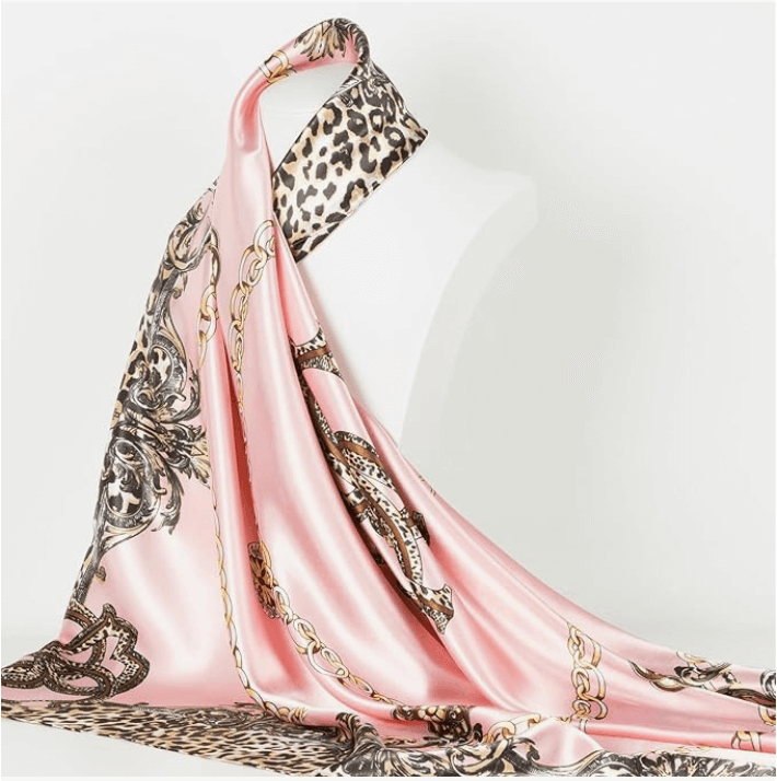 Veloura Satin Headscarf in pink with leopard print and gold chain design, perfect for versatile styling.