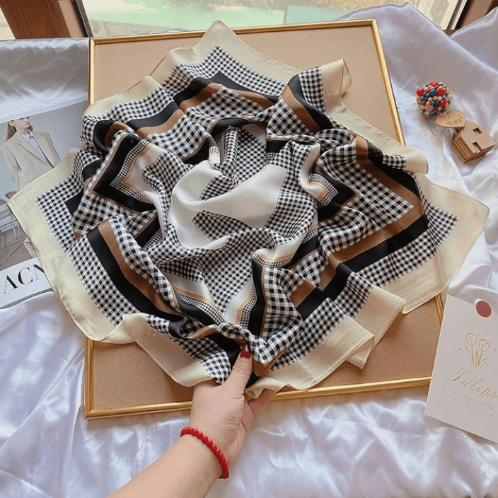 Vintage Luxe Satin Scarf in black and cream with geometric patterns, perfect for festivals and versatile styling.