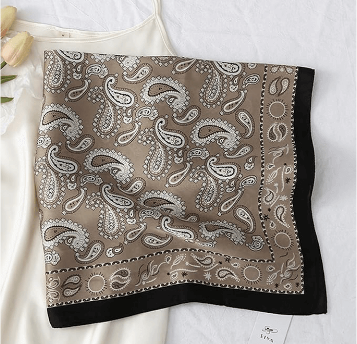 Vintage Luxe Satin Scarf featuring a paisley design in beige and black, perfect for styling as headwrap or accessory.