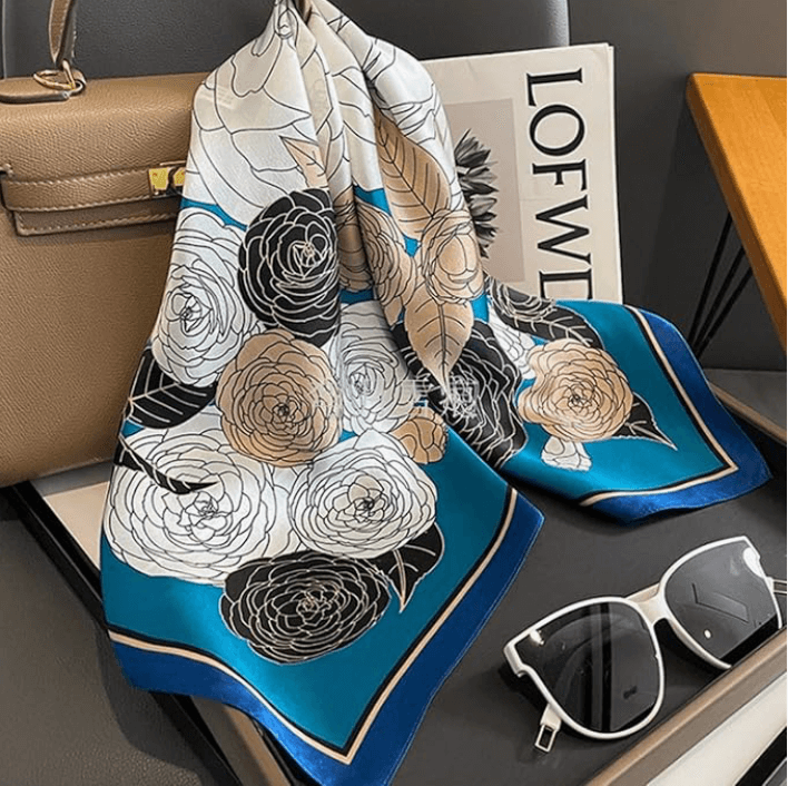 Vintage Luxe Satin Scarf featuring floral design, perfect for styling as a headwrap or bandana, styled with accessories.